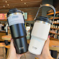 Stainless Steel Coffee Mug with Wide Mouth Design Portable Hideaway Handle Perfect Sip Anti-Skid Base Vacuum Flask Thermos for Hot & Cold Beverage 600ml 750ml 900ml Ideal for Travel and Daily Use